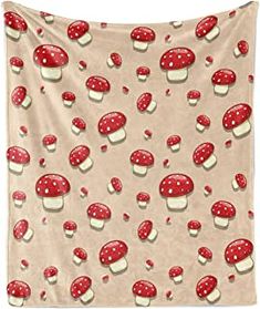 a red and white wall hanging with mushrooms on it