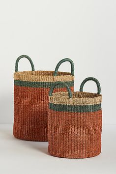 two woven baskets with handles and handles on each side, one is orange and the other is green