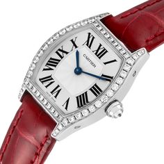 Cartier Tortue 18k White Gold Diamond Ladies Watch WA501007. Manual winding movement. 18K white gold case 24.0 x 30.0 mm. Octagonal crown set with a diamond. Diamond lugs. 18K white gold bezel with factory Cartier diamonds. Scratch resistant sapphire crystal. Silver dial with Roman numerals. Blue sword shape hands. Secret signature at VII. Red leather strap with 18k white gold deployant buckle. Holiday Necklace, Authentic Vans, New Rolex, Gold Case, Women Wrist Watch, Beautiful Watches, Ladies Watch, Roman Numerals, Luxury Accessories