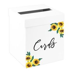 a white box with sunflowers and the word cards on it's side