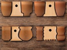 wooden cutting tools are lined up on a wood surface, with holes in the middle