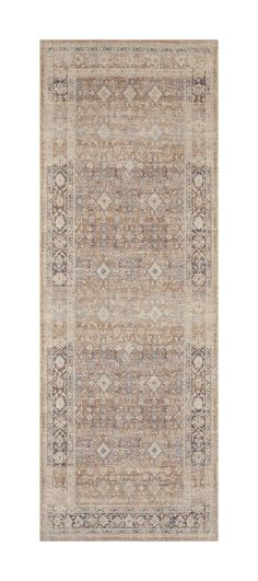 an area rug with various colors and patterns on the floor, including beiges, browns, and blue