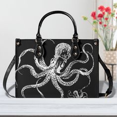 "► ABOUT THIS LUXE JANE PURSE * Removable shoulder strap so you can carry this purse as a shoulderbag or handbag * Zipper closure on main compartment * Colors & Design: Black and white octopus * Metal Color: Gold * Reinforced with rivets * PU (vegan vinyl)  * The design is printed on all sides.  * The handle and trim are black.  * Two top handles (not removable) * Two inside pockets  Made from high-grade vegan PU polyvinyl. This is a TEXTURED material made to resemble leather Can be used as a ni Large Capacity Crossbody Satchel As Gift, Faux Leather Tote Bag As A Gift, Trendy Satchel With Adjustable Strap As Gift, Gift Satchel With Detachable Strap And Double Handle, Large Capacity Faux Leather Shoulder Bag Gift, Gift Double Handle Satchel With Detachable Strap, Faux Leather Satchel Shoulder Bag Gift, Black Shoulder Bag With Detachable Strap As Gift, Faux Leather Shoulder Bag Perfect As A Gift