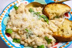 a plate with bread and macaroni salad on it