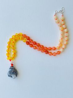 I am motivated to pursue my true purpose. I am comfortable with my power. I am ambitious and capable of whatever I desire. My solar plexus chakra is balanced. This purchase includes: Gemstone Mala, baggie, box, card including using your mala, intention setting and properties. GEMSTONES Calcite: As a strong solar plexus chakra stone, Yellow Calcite is amazing when it comes to helping you in transitory periods of life. It builds up self-esteem and a positive attitude ensuring you can shine. Orange Spiritual Amber Crystal Necklaces With Gemstones, Orange Jewelry With 108 Beads For Meditation, Amber Crystal Necklace For Meditation With Natural Stones, Amber Beaded Necklace For Meditation, Spiritual Adjustable Hand-strung Crystal Necklaces, Orange Spiritual Necklace With 108 Beads, Adjustable Hand-strung Spiritual Crystal Necklaces, Spiritual Amber Necklace For Healing, Amber Crystal Pendant Necklace For Meditation