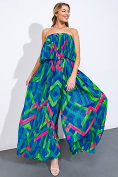 Elevate your wardrobe with our intricately pleated, printed woven jumpsuit. Featuring a straight neckline, flounce detail, and an elasticized waist to accentuate your figure, this piece embodies sophistication and style. Complete the look with statement accessories and embrace the luxury of our wide-leg design.Details:Self : 100% PolyesterLining : 100% PolyesterSize & Fit- Model is 5`8" And Wearing Size Small- Measurements Taken From Size Small- Approx. Length: 50" 50th Clothing, Lounge Party, Pleated Jumpsuit, Business Baby, Flying Tomato, Strapless Jumpsuit, Tall Girl, Color Azul, Tube Top