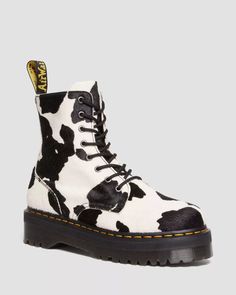 Don't fade into the background. Show off your style with this standout version of the Jadon boot, made of statement-making Cow Print Hair On leather. Featuring our signature Quad sole with grooved detailing and yellow welt stitch, plus black laces, an inside zip, and a black-and-yellow heel loop. The Jadon boot upgrades the 8-eye boot to a whole new level. Look more statuesque and feel more daring - Hair On is an all-natural printed material made with real hair and leather. Plus, it stands highe Cow Print Boots, Jadon Boots, Dr Martens Jadon, Boot Stand, Print Boots, Yellow Heels, Fur Accessories, Goodyear Welt, Doc Martens