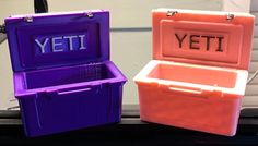 two plastic storage boxes with the letters yeti and yeti written on them sitting next to each other