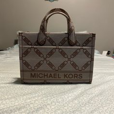 The Bag Is In Perfect Condition, Only Used Twice. It Is Extremely Spacious On The Inside And Has A Front Pocket And An Inside Zipper Pocket. The Strap Is Adjustable To Any Size And The Color Is No Longer Sold On The Michael Kors Website. I Am Willing To Negotiate On The Price! Chic Monogram Canvas Tote Box Bag, Chic Monogram Canvas Box Bag For Everyday Use, Beige Monogram Canvas Satchel, Rectangular Monogram Canvas Shoulder Bag For Errands, Rectangular Monogram Canvas Satchel For Shopping, Monogram Canvas Crossbody Box Bag For Shopping, Everyday Rectangular Monogram Canvas Box Bag, Monogram Canvas Box Bag With Removable Pouch, Chic Monogram Canvas Rectangular Satchel