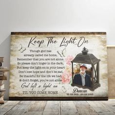 a wooden sign with an image of a man in a lantern on it and the words, keep the light on