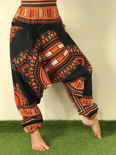 "Dashiki Design, Harem Pants ,Handmade pants, Thick Smock Waist Low Crotch,Bohemian Harem cotton pants, African Dashiki Harem, Aladdin harem pants are very roomy, loose fitting and extremely comfortable. Elasticated both at the waist and ankle, with the crotch just below the knee. Bohemian Harem Unisex pants, Aladdin pants, Baggy Pants, Drop Crotch Pants. Dashiki pants, Yoga pants, Boho Hippi pants. *Fabric Type: Best Quality Fabric Cotton 100%. *Elastic Waist and around ankle. *Quality sewing. Cotton Gauze Pants, Yoga Harem Pants, Cotton Ball Lights, Samurai Pants, Handmade Pants, Gauze Pants, Unisex Pants, Yoga Trousers, Bohemian Pants