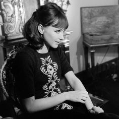 black and white photograph of a woman sitting in a chair