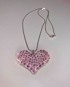 This glamorous heart necklace is handcrafted on transparent acrylic, while embellished with light rose pink Swarovski crystals.  The necklace is lightweight, comfortable to wear, and is perfect for styling up with any look.  The care and craftsmanship that went into creating this piece truly showcases art around your neck.  This necklace sparkles even more beautifully in person especially in the natural sunlight.  Each crystal is hand set with the strongest bond adhesive and crafted with the highest quality in materials and craftsmanship guaranteed by Lara Glam Jewelry. ♡ M O R E ∙ D E T A I L S * Crystals: Swarovski crystals - light rose pink * Material: Acrylic * Stone Qty: Approximately 73 crystals  * Pendant Dimensions: Approximately; 1.6 inch (42mm) in length x0.94 inch (24mm) in widt Pink Crystal Heart Pendant Jewelry, Pink Crystal Heart Pendant Necklace, Pink Crystal Jewelry For Valentine's Day, Pink Crystal Necklace With Heart Charm, Pink Heart Cut Necklace For Party, Valentine's Day Party Crystal Heart Necklace, Heart-shaped Crystal Necklace For Party, Heart Shaped Bling Necklace For Gift, Pink Bling Necklace For Gift