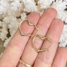 10KT yellow gold polished open heart hoop earrings in medium size. We carry 3 sizes of this style earring- this is the middle size. Measures: 22mm x 19mm Thickness: 3mm Hollow Finished on all sides Weight: .65g Heart Hoop Earrings, Gold Polish, Open Heart, Infinity Bracelet, Medium Size, Hoop Earrings, Yellow Gold, Yellow, Gold