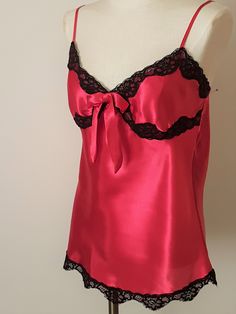 Gorgeous shade of cherry  red satin bias cut camisole with matching pajama  lounging pants . A contrast of black lace  trim  makes a glamourous  ensemble . Size Large   Bust 36"  Waist 34"  length 18"  adjustable shoulder straps.   Pant   elastic  Waist  33"  with extra stretch    pant leg  39" .In very good condition  one previous owner . Machine Wash Cold Water Delicate Setting   Or  Hand Wash Hang To Dry. Shameless Dr, Matching Pajama, Pyjama Satin, Camisole Set, Pyjama Sets, Black Lace Trim, Pajama Pant, Matching Pajamas, Womens Pyjama Sets