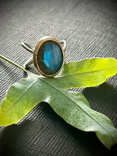 Handcrafted Sterling Silver and Gold Filled  Ring with Labradorite .  Approximate size 6.75 Handmade Spiritual Open Opal Ring, Unique Hand Forged Moonstone Ring Gift, Handmade Minimalist Moonstone Ring, Unique Oval Opal Ring For Jewelry Making, Handmade Minimalist Round Opal Ring, Artisan Rings With Natural Stones For Gift, Handmade Unique Moonstone Ring, Artisan Oval Moonstone Ring, Handmade Artisan Crystal Ring