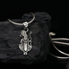 Metal-925 sterling silver. Item type-Pendant Weight-2.320 grams. Height-3.2 centimetre. Width-1.3 centimetres. Stamped-925. Finish-Oxidized. Chain details: chain width-1.5mm(if buy) Weight-12.500 to 18.500 grams(weight varies as per length) Chain type-screw chain. Sterling Silver Amulet Necklaces For Puja, Sterling Silver Amulet Necklace For Puja, Silver Amulet Necklaces For Puja, Sterling Silver Hallmarked Necklaces For Rituals, Sterling Silver Necklaces With Oxidized Finish For Puja, Symbolic Sterling Silver Necklaces For Festivals, Sterling Silver Necklaces For Festivals And Gifts, Symbolic Sterling Silver Jewelry For Puja, Silver Pendant Necklaces For Puja