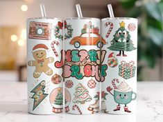 three christmas themed tumblers sitting on top of a table