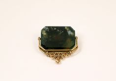 Victorian Era Spinner Fob features a central semi transparent moss agate stone. When held up to the light lovely swirl of rich hues of green can be seen. Very uplifting and soothing. Its framed in 14k gold and can be worn as a pendant. Moss agate as always been seen as a lucky amulet. Elegant Agate Pendant Gemstone, Elegant Moss Agate Cabochon Jewelry, Elegant Rectangular Agate Jewelry, Elegant Gemstones With Natural Inclusions For Gift, Grapevine Tx, Moss Agate Stone, Navajo Turquoise, Vintage Navajo, Semi Transparent