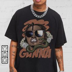 Gunna Streetwear Gifts Shirt Hip Hop 90s Vintage Retro Graphic Tee Comic Rap T-shirt 90s Graphic Print T-shirt For Streetwear, Casual Cartoon Print Shirt For Streetwear, 90s Graffiti Print T-shirt For Streetwear, Pop Culture Streetwear Shirt With Letter Print, Hip Hop Cartoon Print Tops For Streetwear, Retro Streetwear Tops With Cartoon Print, Retro Tops With Cartoon Print For Streetwear, Crew Neck Shirt With Cartoon Print For Streetwear, Retro Cartoon Print Tops For Streetwear