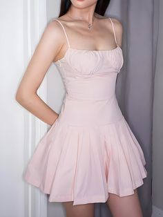 This delightful dress features a flattering pleated skirt and a fitted bodice with delicate spaghetti straps. The soft pink hue adds a touch of femininity and grace, making it perfect for various occasions, from casual outings to special events. Crafted from lightweight and breathable fabric, this mini dress ensures you stay comfortable and stylish all day long. Elasticated back Pleated skirt Invisible zip fastening at side Ruched bust Spaghetti straps Square neck Open back Polyester Pink Dress With Adjustable Straps And Sweetheart Neckline, Pink Dress With Sweetheart Neckline And Adjustable Straps, Pink Square Neck Mini Dress With Ruched Bodice, Chic Pink Dress With Adjustable Straps, Feminine Mini Dress With Spaghetti Straps, Spring Dress With Pleated Waist And Sweetheart Neckline, Pink Mini Length Suspender Dress For Spring, Pink Spring Suspender Dress, Spring Pink Mini Length Suspender Dress