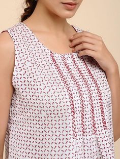 An offwhite chanderi sleeveless dress with red blockprint and hand embroidery detail in front Features: Fabric - Chanderi Fit - Loose/comfortable Handmade in India Garment measurements (in Inches): Size S : Bust-36", Waist-35", Length- 38"-40" Size M : Bust-38", Waist-37", Length- 38"-40" Size L : Bust-40", Waist-39", Length- 38"-40" Instructions: Dry clean only Note: Pants not included with the product This product will be shipped within 20-25 days of the order placed Chanderi Dress, Sleeveless Kurta, Embroidery Online, Shibori Dye, Shopping Coupons, Morning Glory, Embroidery Details, Shibori, Women Dresses