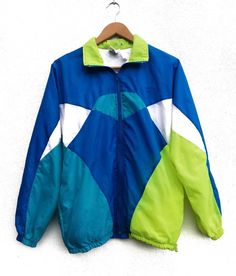 "Please read all description carefully before buying. If you have any questions feel free to ask. Vintage 90's Nike Grey Tag Neon Color Jacket Colour : Blue, Green Size on tag : S Brand : Nike Condition : Good condition. MEASUREMENT Armpit to armpit : 23\" Shoulder to bottom hem : 26\" PLEASE CHECK ACTUAL SIZE CAREFULLY, NO RETURNS OR COMPLAINT FOR WRONG SIZE ACTUAL. ACCEPT PAYPAL ONLY. Shipping cost is $25 via DHL Express wordwide shipping. Transit time can take 3-5 business days to reach desti Green Nylon Color Block Outerwear, Green Color Block Nylon Outerwear, Green Color Block Track Jacket For Streetwear, Green Long Sleeve Patchwork Windbreaker, Retro Multicolor Windbreaker For Streetwear, Green Color Block Windbreaker For Streetwear, Retro Green Color Block Outerwear, Green Color Block Windbreaker For Winter, Green Sporty Track Jacket With Patchwork