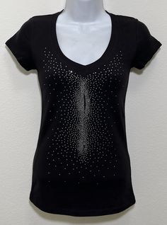 Fabric comprised of 95% cotton and 5% spandex.  Handmade rhinestone t-shirts made in the United States with quality rhinestones. Machine washable. T-shirt style is a fitted V-neck cap sleeve. Size Range:         XXS = 2         XS = 4         S = 6         M = 8         L = 10         XL = 12 Fitted Black T-shirt With Rhinestones, Rhinestone Cotton Tops With Short Sleeves, Cotton Rhinestone Short Sleeve Top, Cotton Short Sleeve Top With Rhinestones, Cotton Tops With Rhinestones And Short Sleeves, Embellished Fitted Cotton T-shirt, Fitted Cotton Embellished T-shirt, Stretch Crew Neck Top With Rhinestones, Fitted Cotton Top With Rhinestones