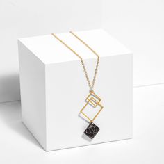 An elegant twist on our classic best-seller, this intersecting squares pendant is elevated by marble-looking square howlite stones (it's like marble, but without the weight!). Please note: because of their nature, the stones will have slightly different details. No two stones are alike. Material- Square pendants: gold plated or silver plated - Chain: gold filled cable chain (yellow or rose gold), or sterling silver- Nickel free, lead freeDimensions: - The pendant measures approximately 7 1/8" x Pendants Gold, Rose Gold Marble, Square Necklace, Howlite Stone, Square Pendant, Geometric Necklace, Gold Marble, Marble Stones, Chain Gold