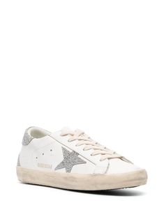 Find GOLDEN GOOSE DELUXE BRAND Superstar Glitter-embellished Sneakers on Editorialist. white/silver-tone buffalo leather front lace-up fastening round toe perforated detailing signature star patch to the sides gold-tone logo lettering glitter detailing flat rubber sole White Leather Glitter Sneakers, White Leather Sneakers With Glitter, White Leather Sneakers With Glitter Accents, White Glitter Lace-up Sneakers, White Low-top Sneakers With Glitter Accents, Embellished Sneakers, Golden Goose Deluxe Brand, Buffalo Leather, Golden Goose