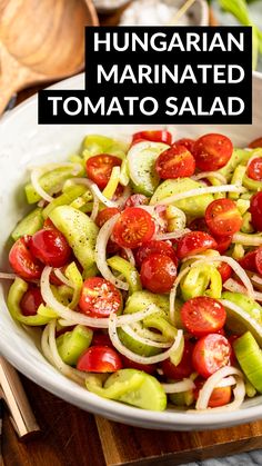 a white bowl filled with sliced tomatoes and onions