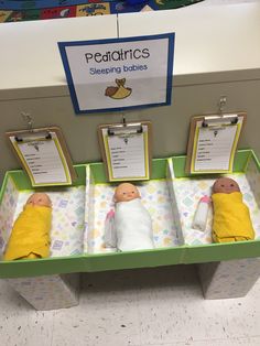 there are three baby dolls on display in the toy store's changing table area