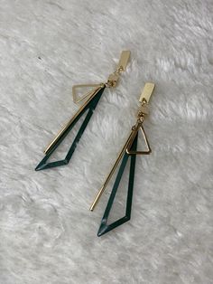 Green Gold Stylish Elegant Classy Dangle Drop Earrings Product: P00022 Upgrade your style with these gorgeous and so lightweight green and gold earrings, perfect for adding a touch of sophistication to any outfit. Handmade with care, each earring features a green part beautifully. The gold-toned metal setting adds a touch of elegance and contrasts perfectly with the dark green colour. These versatile earrings are perfect for dressing up your outfit for a night out or adding a touch of glamour to your everyday look. The lightweight design makes them comfortable to wear all day long. These earrings also make a great gift for anyone who loves unique, handmade jewellery. Each pair is crafted with quality materials and attention to detail, so you can shop with confidence knowing you're getting Green Drop Earrings For Party, Trendy Green Metal Jewelry, Green Linear Earrings For Parties, Chic Green Earrings For Gift, Elegant Green Drop Linear Earrings, Green Metal Dangle Hoop Earrings, Green Dangle Metal Hoop Earrings, Green Dangle Hoop Earrings In Metal, Trendy Green Dangle Hoop Earrings