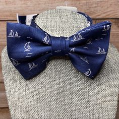 This Pre-Tied Adjustable Nautical Sailboat Bow Tie From Saddlebred Will Be The Perfect Finishing Touch To Any Outfit, Especially For A Boat Lover Or Nautical Ensemble! “Add Nautical Style To Your Outfit With This Sailboat Patterned Bow Tie!” Details: -Pre-Tied/Adjustable Straps -Woven/Polyester I Also Have A Few Other Novelty Ties Listed If You Want To Check Them Out! Bundle And Save! If You See A Few Things You Like In My Closet, Create A Bundle And Save On Shipping! Classic Blue Bow Tie For Summer, Blue Bow Tie With Bow Tie Back For Summer, Elegant Blue Bow Tie With Butterfly Knot, Nautical Belt, Blue Adjustable Standard Tie Bow, Blue Butterfly Knot Bow Tie, Nautical Dog Bandana, Tie Colors, Nautical Fashion