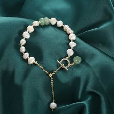 Crafted with high-quality genuine freshwater pearls and accented with aventurine gemstones, this bracelet is a true statement piece. Each pearl is hand-selected for its radiant luster and is 100% unique, while the aventurine gemstones add a touch of natural beauty to this exquisite piece. Whether you're dressing up for a special occasion or adding a touch of sophistication to your everyday look, our pearl bracelet is the perfect accessory for any occasion. Genuine natural freshwater pearls Accen Elegant Green Pearl Bracelet With Natural Stones, Elegant Green Jade Pearl Bracelet, Elegant Green Jade Bracelet, Elegant Green Pearl Bracelet, Elegant Jade Pearl Bracelet For Gift, Elegant Aventurine Bracelet Jewelry, Elegant Aventurine Bracelet, Number Bracelets, Pink Aventurine