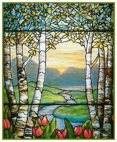 a stained glass window with trees and flowers