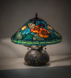 a stained glass lamp on a white table