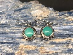 Turquoise Earrings // Sterling Silver // Ornate Bali Setting // Turquoise Jewelry Weight: 5 grams Length: 1.2 inches Stone: Turquoise Hallmark 925 Finish: shiny, oxidized Note: please pay attention to the size and weight before purchasing. This is a very delicate and light weight earring. Round Turquoise Earrings For Gift, Hypoallergenic Turquoise Oval Earrings, Turquoise Cabochon Drop Earrings, Turquoise Round Pierced Jewelry, Vintage Turquoise Round Earrings, Oct 1, Light Weight Earrings, Earrings Sterling Silver, Turquoise Earrings