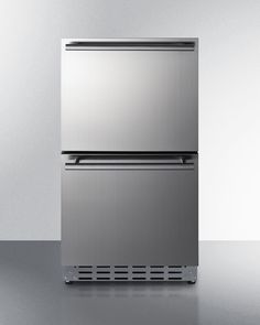 a metallic refrigerator freezer sitting on top of a counter