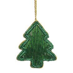 a green christmas tree ornament hanging from a gold chain