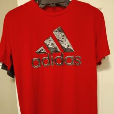 New With Tags! Set Of 2 Boys Adidas T-Shirts Size: 14/16 100% Polyester Adidas Red Crew Neck T-shirt, Red Adidas Crew Neck T-shirt, Adidas Red Short Sleeve T-shirt, Red Adidas Short Sleeve T-shirt, Red Graphic Tee For Sports, Adidas University Red Short Sleeve Top, Adidas Red Sports Top, Adidas Tops In University Red With Short Sleeves, Adidas Red Short Sleeve Top