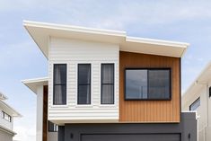 a house with two garages in front of it