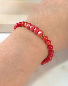 This amazing one-of-a-kind bracelet is created with red jade beads and enhanced by high quality Czech Preciosa glass beads. Strung on double stretch floss for extra durability. Measures approximately 7". Red Bracelet, Red Jade, Red Bracelets, Bead Stringing, Jade Beads, Glass Beads, Jade, Elastic, Bracelet