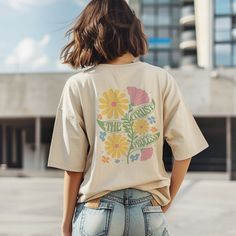 Embrace summer vibes with our boho floral shirt, a charming gift for her! This oversized tee features a retro design with wildflowers and a motivational quote. Perfect for girls who love unique style and comfy fashion statements. Boho & Cottagecore: https://etsy.me/3QnmGud  Yoga Clothes: https://etsy.me/4axsVUp Coffee Mugs: https://etsy.me/4cIpxHM Tote Bags: https://etsy.me/4cTKi3l " An extraordinarily imaginative print, the shirt was delivered very quickly and the recipient is totally happy wit Oversized Floral Print T-shirt For Spring, Bohemian Relaxed Fit T-shirt With Letter Print, Oversized Bohemian Summer T-shirt, Oversized Bohemian T-shirt For Summer, Custom Print Summer Tops For Everyday, Cute Oversized T-shirt For Spring, Custom Print Summer Top For Everyday, Custom Print Tops For Everyday Summer Wear, Custom Print Top For Everyday Summer Wear