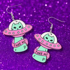 These Unique And Funny Ufo Cat Acrylic Earrings Come In A Playful Pink And Mint Green Color Scheme. They Feature A Cute Cat In A Ufo With The Words "Take Me" For An Extra Whimsical Touch. Crafted With A Stainless Steel Earring Post For Durability And Comfort, These Earrings Are Perfect For Adding A Quirky Vibe To Your Style. Size: 2.38" X 1.5" Mint Green Color Scheme, Sparkly Fishnets, Red White Blue Dress, Cat Acrylic, Steampunk Cat, Retro Love, Retro Girl, Pink And Mint, Green Color Schemes