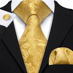 If you're seeking a distinctive touch to elevate your ensemble, explore our Gold Paisley XL Tie Set at Sophgent. The tie is made of high-quality silk, giving it a luxurious feel and ensuring it will hold its shape well. Whether you're attending a wedding, a job interview, or a night out on the town, this tie is sure to make a statement. Add it to your collection today and elevate your style. 100% Silk Handmade Includes: Tie, Pocket Square and Cufflinks Length: 63" Width: 3.34" Warm iron if neede Luxury Ties For Office Suit Accessories, Luxury Business Suit And Tie Accessories, Luxury Gold Tie For Formal Occasions, Gold Suit And Tie Accessories With Pocket Square, Luxury Gold Tie For Black Tie Events, Elegant Gold Ties For Business, Gold Tie For Black Tie Events, Classic Gold Suit And Tie Accessories With Pocket Square, Gold Cufflinks For Black Tie Events