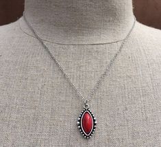 "Simple, chic and versatile! Here is a red stone necklace that is set in a perfectly detailed silver frame. The perfect everyday necklace! Made from allergy free plated silver. The pendant measures 1\" long by 1/2\" wide. It hangs from a shiny strong 18\" stainless steel necklace chain with a lobster clasp. I have matching earrings in my shop if you would like the whole set. Here is the link https://etsy.me/2R5NsWx I have this same style pendant necklace available in other color ways as well! He Southwestern Style Red Necklace For Gift, Red Southwestern Turquoise Necklace For Gift, Red Southwestern Sterling Silver Necklace, Red Southwestern Style Jewelry Gift, Southwestern Style Red Jewelry For Gift, Southwestern Style Red Jewelry For Gifts, Red Stone Necklace, Silver Ball Necklace, Southwestern Necklace