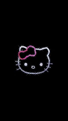 an image of a hello kitty wallpaper in the dark with pink bow on it