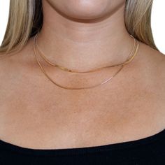 Penelope is a double layered herringbone and box chain necklace. This beautiful necklace will be your new go-to for every day at home, work, or special events. Wear it alone for a minimal look or style it with longer necklace layers. Product Features: Material: 18K gold plated alloy Length: Chains measure 14.5", 16" and can be adjusted an extra 2.5" for 18.5" total length Two layer necklace Lobster claw clasp Layering Snake Chain Necklace, Minimalist Double Chain Herringbone Necklace For Everyday, Double Chain Snake Necklace For Layering, Snake Chain Necklace With Double Chain For Layering, Trendy Layered Snake Chain Necklace With Delicate Details, Dainty Snake Chain Necklace For Layering, Delicate Chain Herringbone Necklace For Layering, Double Snake Chain Necklace For Layering, Gold Double Chain Snake Necklace For Layering