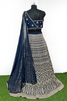 A stunning lehenga with beautiful Heavy Thread Embroidery With Sequence Work blouse, dupatta and lehenga, designed specially for wedding season.Be the best of you for a wedding or festivities with this lehenga choli. The lehenga has a beautiful design and intricate work along its borders which gives it a unique appeal. The lehenga can be paired with fashion sandals for a festive occasion. Blouse & Lehenga Fabric - Georgette Lehenga -Georgette Thread With Sequence Embroidered Lehenga Choli. Blous Blue Georgette Lehenga With Intricate Embroidery, Embroidered Blue Georgette Lehenga, Embroidered Anarkali Choli In Royal Blue, Blue Lehenga With Resham Embroidery In Traditional Drape, Blue Embroidered Lehenga In Georgette, Blue Embroidered Georgette Lehenga, Traditional Royal Blue Lehenga With Resham Embroidery, Royal Blue Embroidered Anarkali Choli, Blue Dola Silk Lehenga For Eid